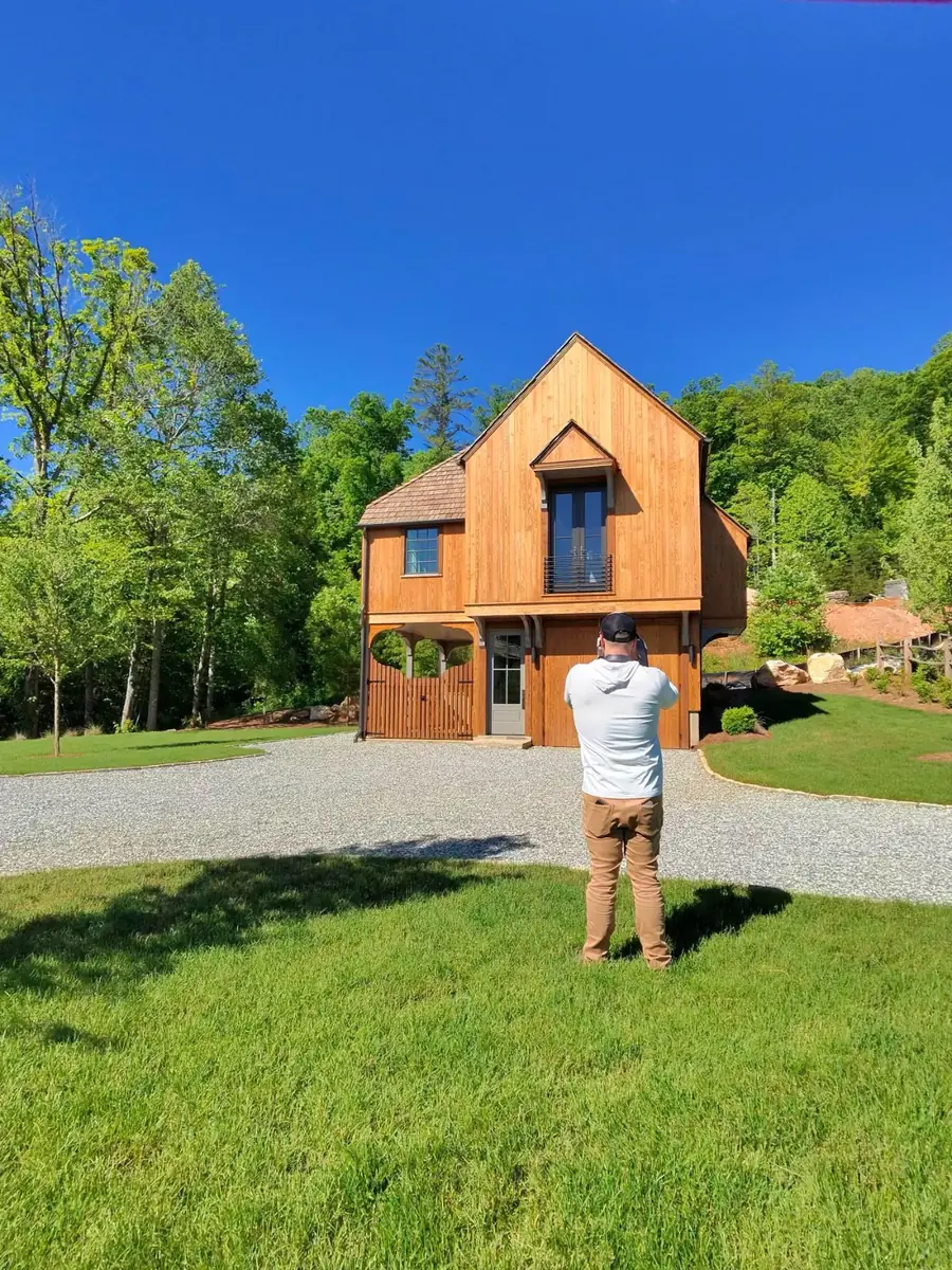 A custom timber home being photographed on site